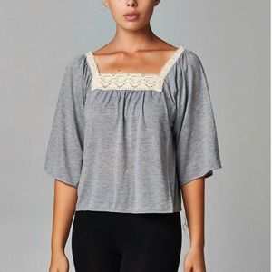 Women’s square neck lace top in a gray.